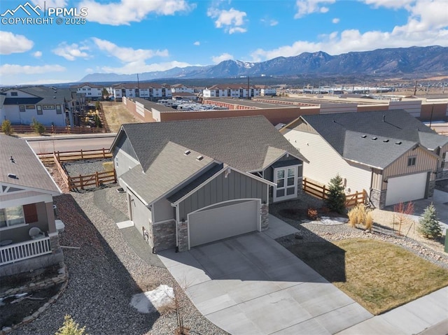 bird's eye view with a residential view and a mountain view