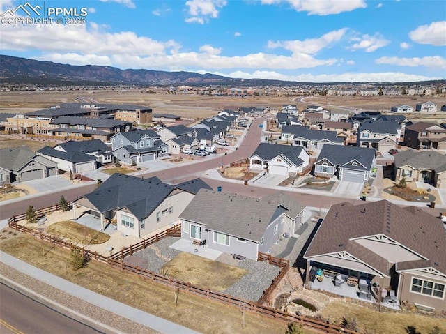 aerial view featuring a residential view and a mountain view