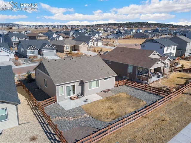 birds eye view of property with a residential view