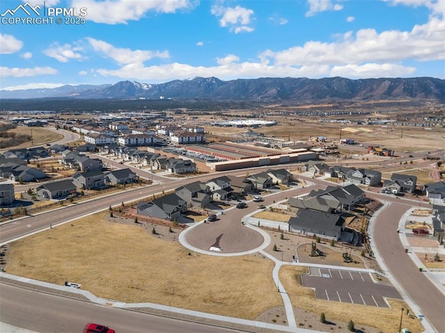 bird's eye view with a residential view and a mountain view