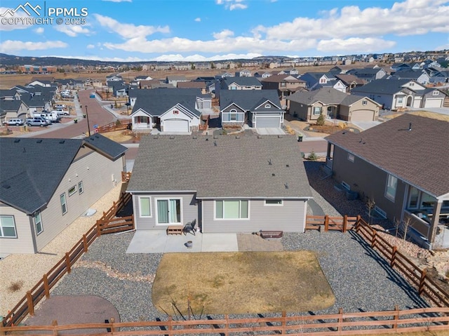 birds eye view of property with a residential view