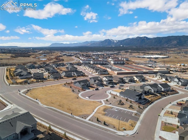 drone / aerial view with a residential view and a mountain view