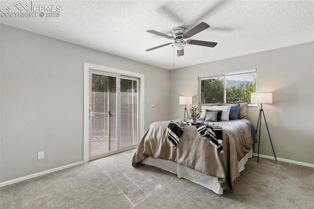 carpeted bedroom with a textured ceiling, access to outside, ceiling fan, and baseboards