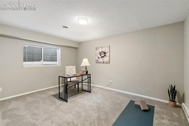 carpeted office space featuring a textured ceiling, baseboard heating, visible vents, and baseboards