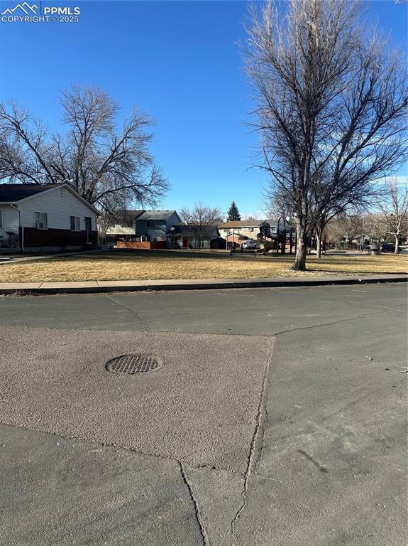 view of road with curbs and sidewalks