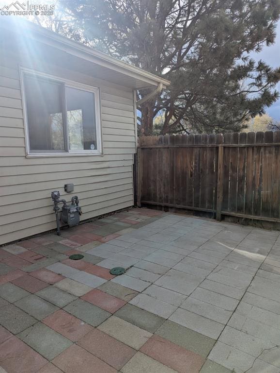 4211 Hunts Mill Ter, Colorado Springs, CO 80910 - view of patio / terrace featuring fence