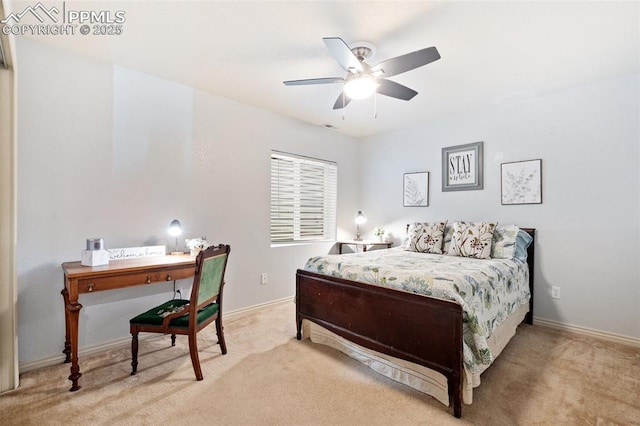 carpeted bedroom featuring baseboards and a ceiling fan