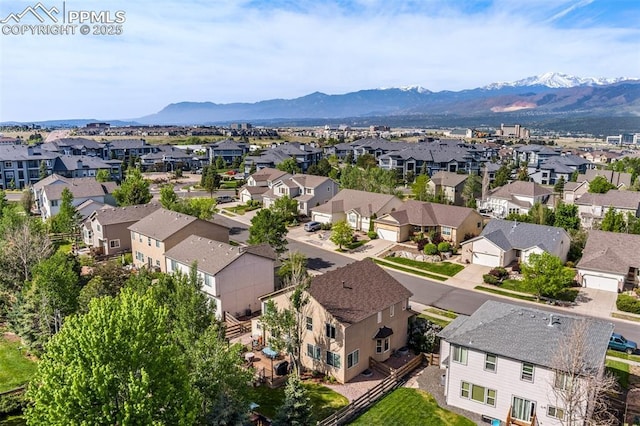 drone / aerial view with a residential view and a mountain view