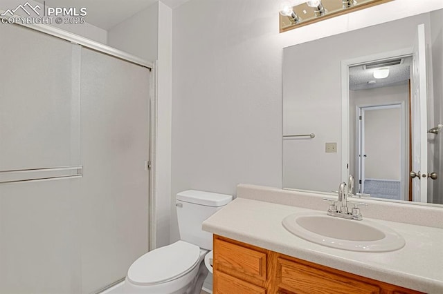 full bath featuring a shower stall, toilet, and vanity