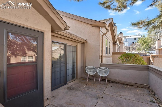 doorway to property with stucco siding