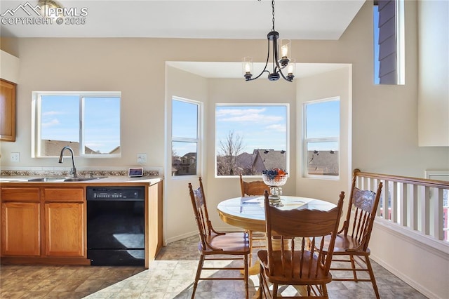 dining area featuring a notable chandelier and baseboards