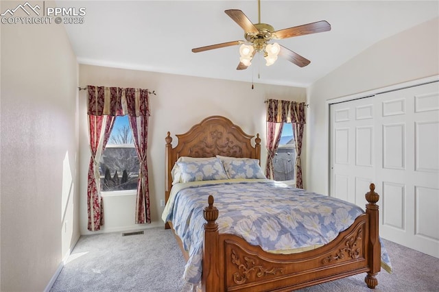 bedroom featuring visible vents, a closet, carpet, and a ceiling fan