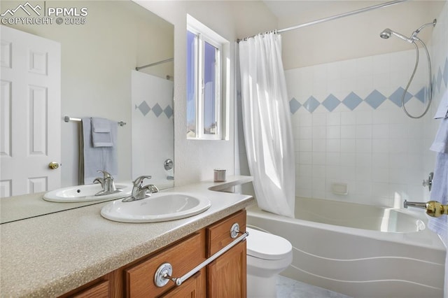 bathroom featuring vanity, shower / bath combo with shower curtain, and toilet