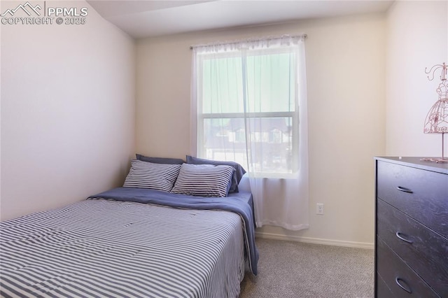 carpeted bedroom with baseboards