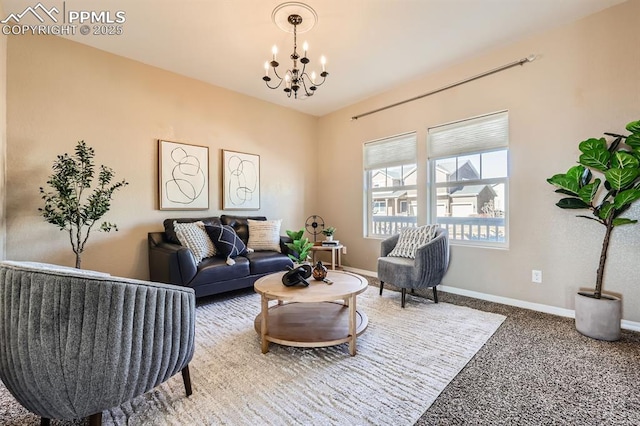 living room with carpet floors, an inviting chandelier, and baseboards