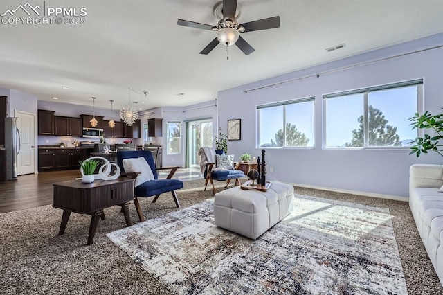 living room with ceiling fan, recessed lighting, visible vents, and baseboards