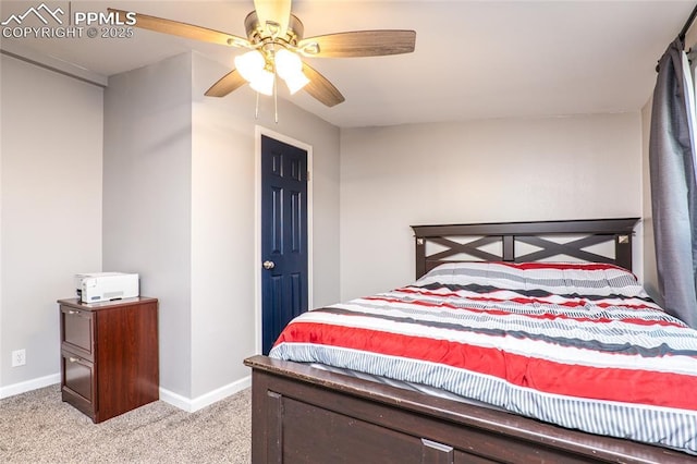 bedroom with light colored carpet, ceiling fan, and baseboards