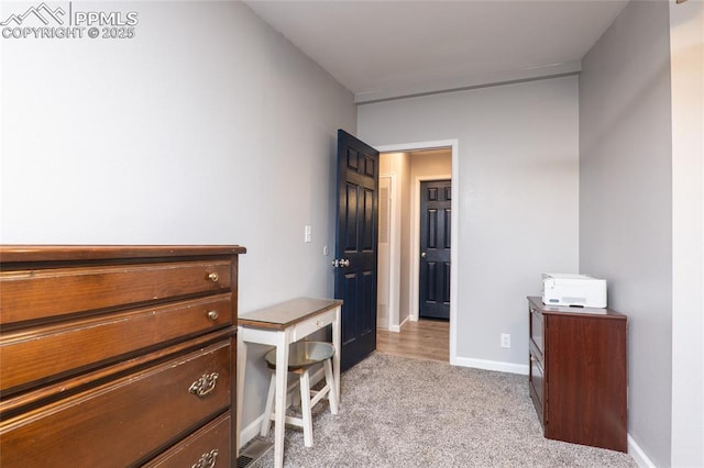 interior space featuring carpet floors and baseboards