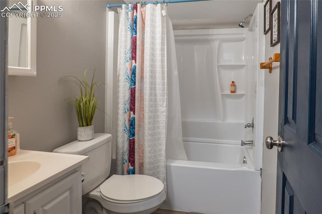 bathroom featuring shower / bath combo, vanity, and toilet