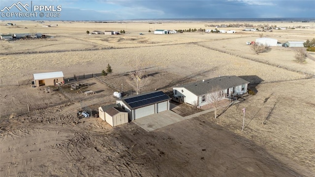 bird's eye view featuring a rural view and a desert view