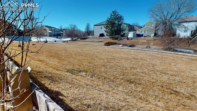 view of yard featuring a residential view