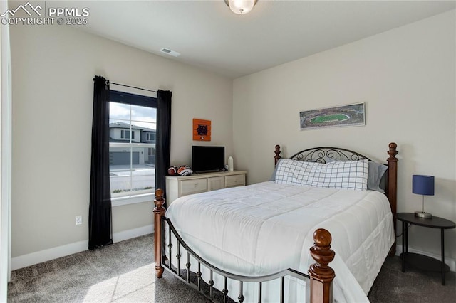 carpeted bedroom with baseboards and visible vents