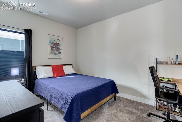 carpeted bedroom featuring baseboards