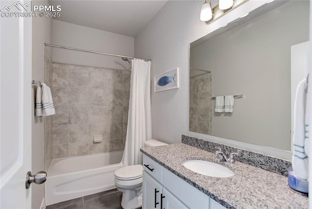 full bath featuring a textured wall, toilet, shower / tub combo, vanity, and tile patterned floors