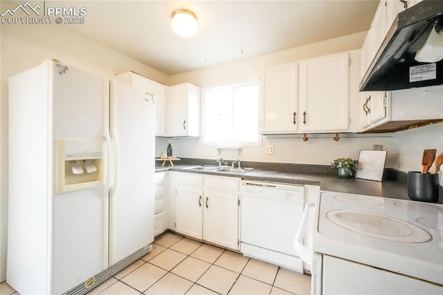 kitchen featuring dark countertops, under cabinet range hood, white appliances, white cabinetry, and a sink