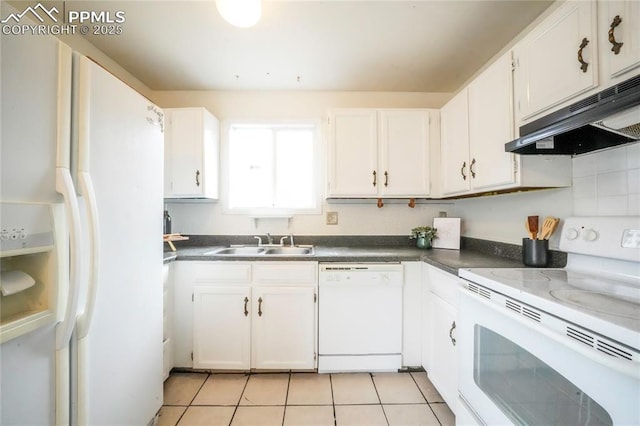 kitchen featuring white appliances, light tile patterned floors, a sink, white cabinets, and under cabinet range hood