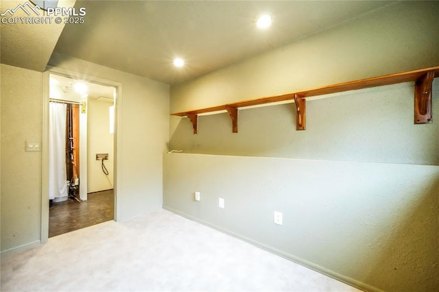 carpeted spare room featuring recessed lighting