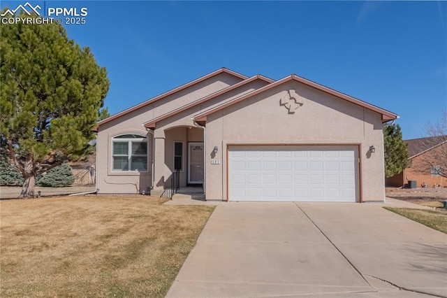 ranch-style house featuring an attached garage, concrete driveway, a front yard, and stucco siding