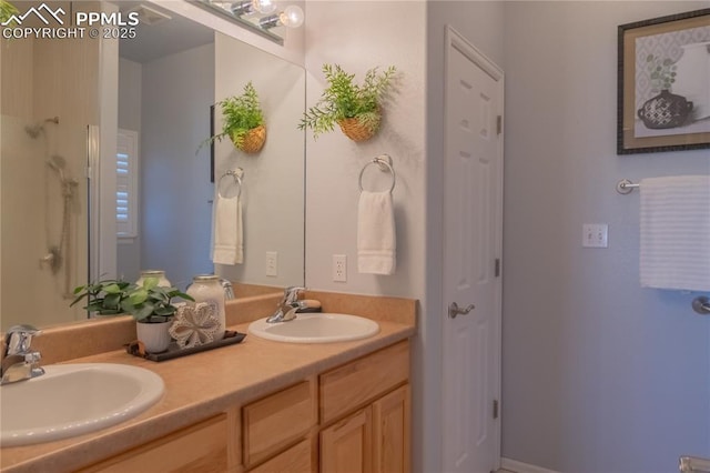 full bath featuring double vanity and a sink