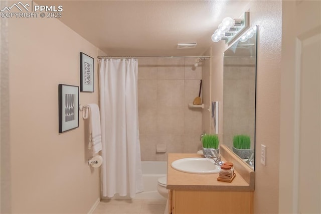 full bath featuring shower / bath combo with shower curtain, vanity, toilet, and tile patterned floors