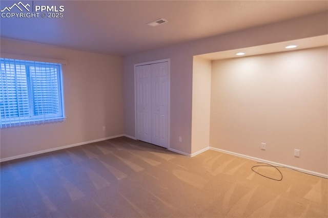 unfurnished bedroom with visible vents, baseboards, carpet, a closet, and recessed lighting