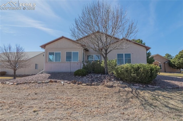 ranch-style house with stucco siding