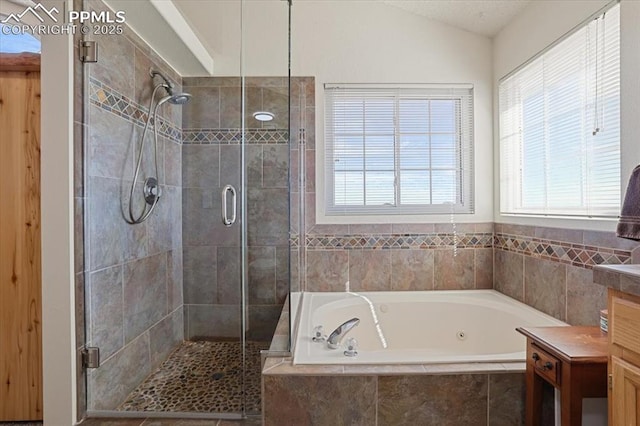 full bath featuring vaulted ceiling, a garden tub, vanity, and a shower stall