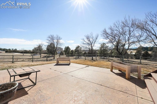 exterior space featuring a rural view and fence