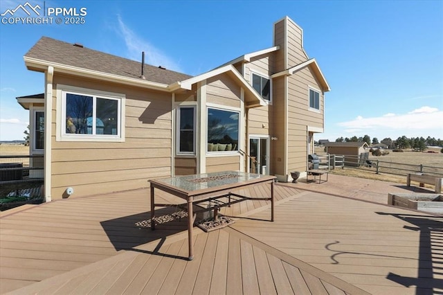 wooden deck featuring outdoor dining area