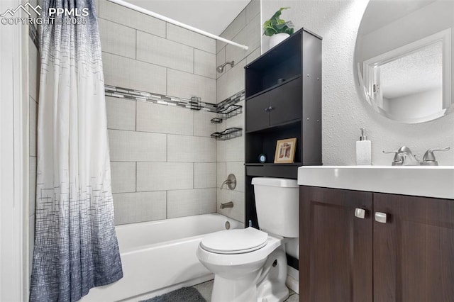 bathroom with toilet, vanity, a textured wall, shower / bath combination with curtain, and a textured ceiling