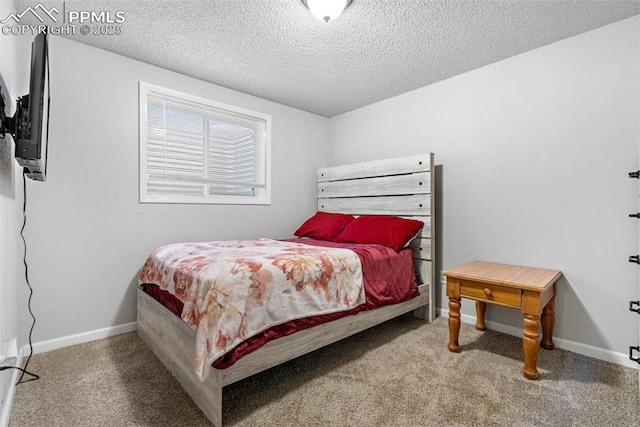 carpeted bedroom featuring baseboards and a textured ceiling