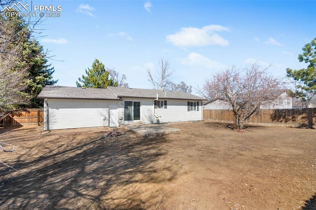 back of property featuring a patio and a fenced backyard