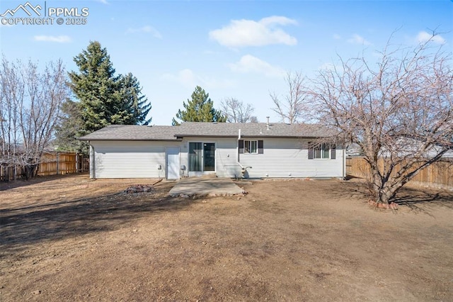 back of house featuring a patio and fence