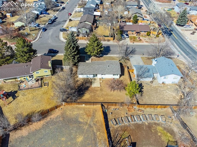 birds eye view of property with a residential view