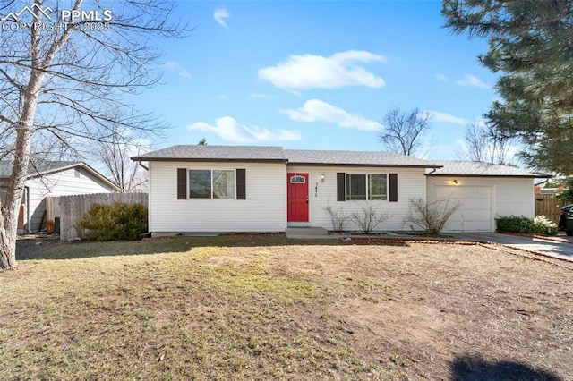 ranch-style home featuring a garage, a front yard, driveway, and fence