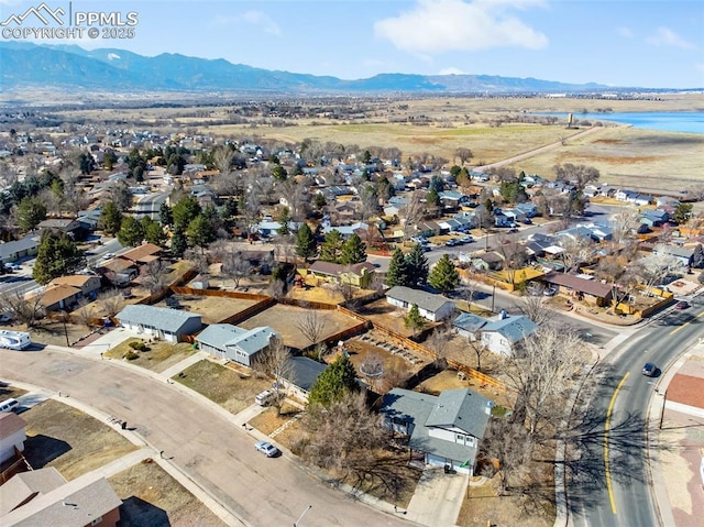 aerial view featuring a mountain view and a residential view