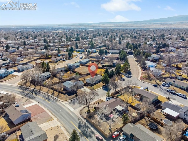 birds eye view of property featuring a mountain view and a residential view