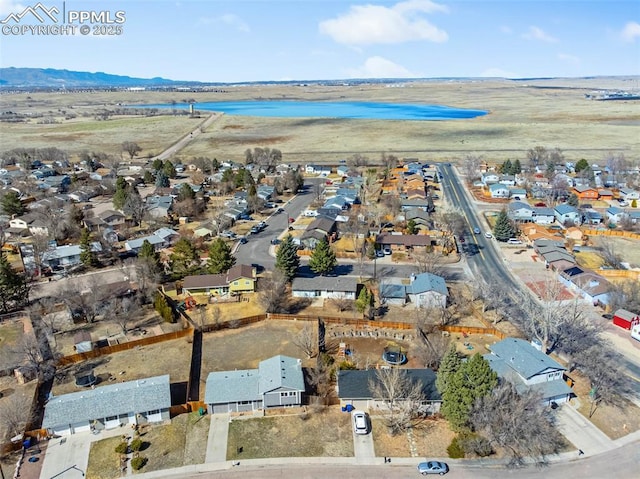 birds eye view of property with a residential view