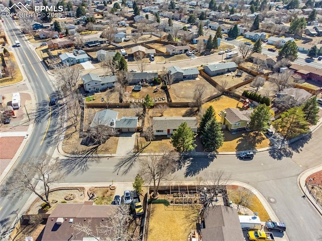 birds eye view of property with a residential view