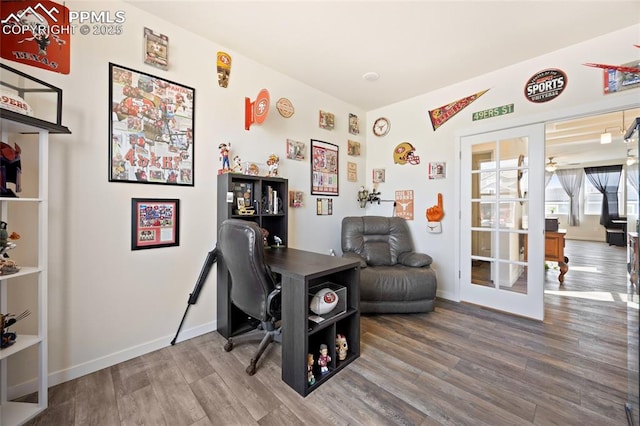 office with wood finished floors and baseboards